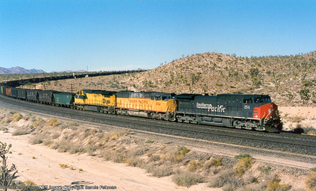Southern Pacific AC44CW #254 (with UP SD60M #6314 & CNW C44-9W #8602) with a loaded westbound coal train